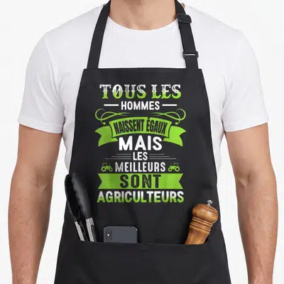 Tablier de cuisine noir avec inscription tous les hommes naissent égaux mais les meilleurs sont agriculteurs en vert et blanc.