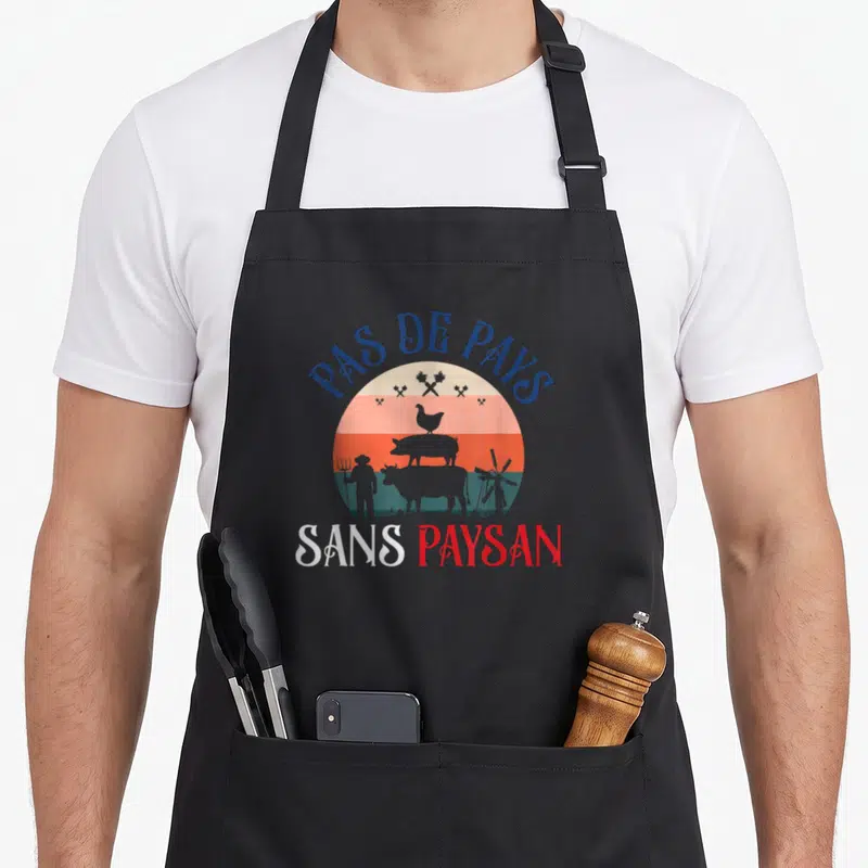 Tablier de cuisine noir avec illustration circulaire rétro d'un fermier, d'animaux et du texte Pas de pays sans paysan.