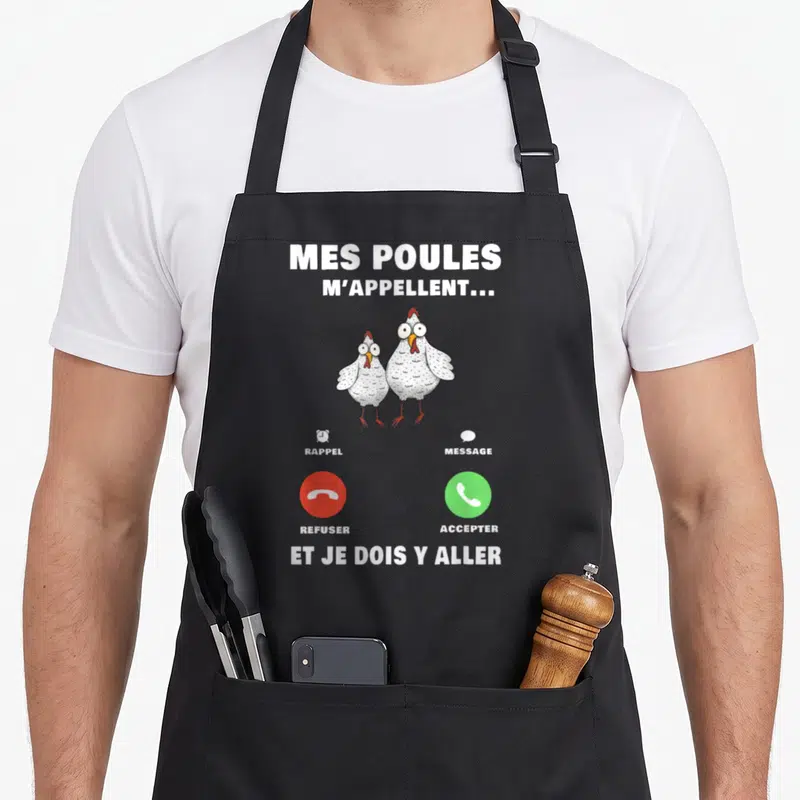 Tablier de cuisine noir avec deux poules blanches et une interface de rappel téléphonique rouge et verte imprimée au centre.