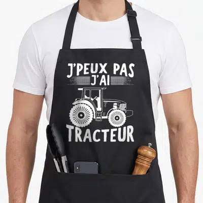 Tablier de cuisine noir avec inscription Je peux pas j'ai tracteur et illustration de machinerie agricole en blanc.