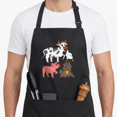 Tablier de cuisine noir avec illustration colorée d'une vache, une poule, un poulain et un porcelet mignons.