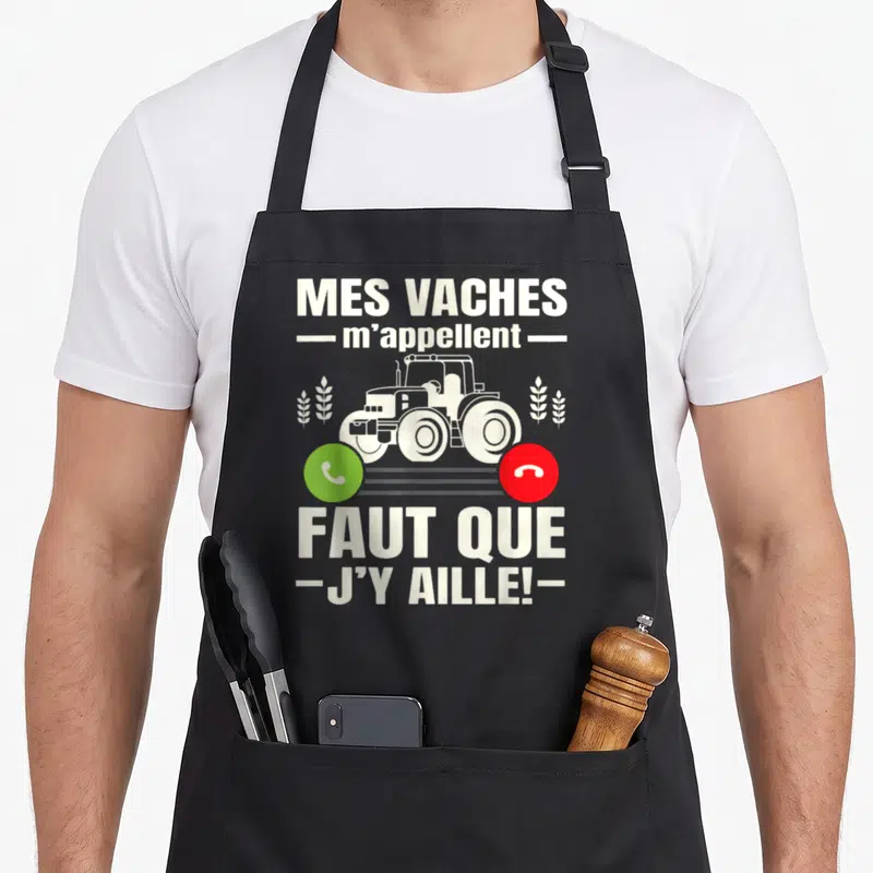 Tablier de cuisine noir avec un tracteur blanc, des épis de wheat et des boutons d'appel vert et rouge.