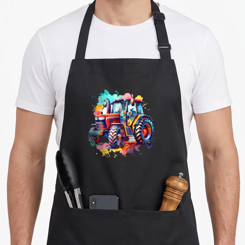 Tablier de cuisine noir avec illustration colorée d'un tracteur Masey Ferguson 5118 au style aquarelle.