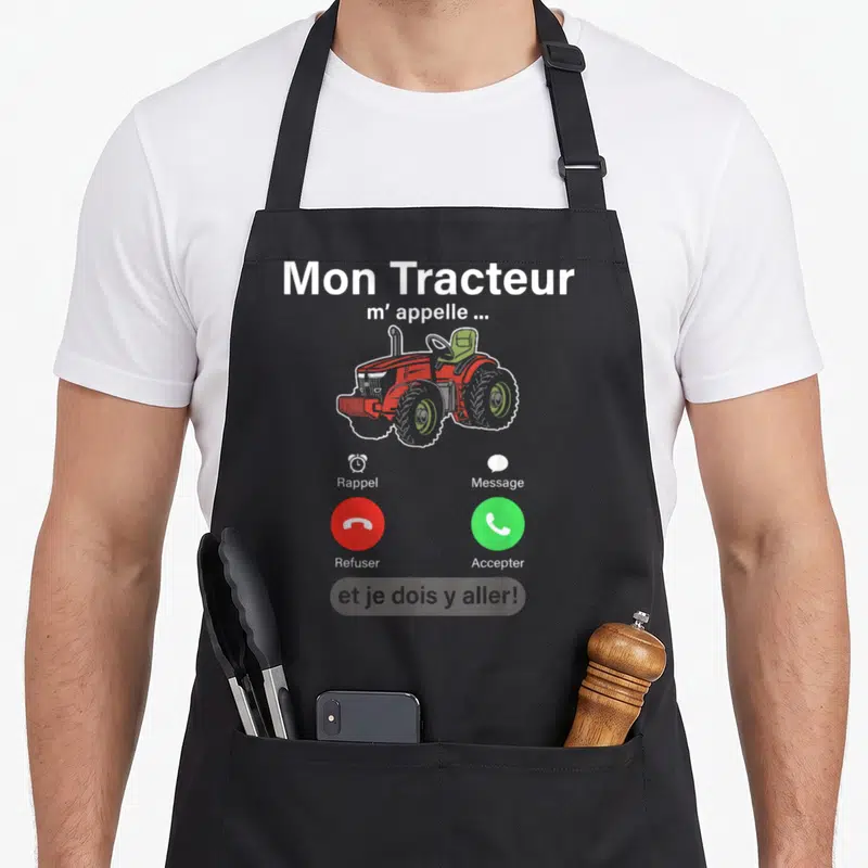 Tablier de cuisine noir avec illustration d'un tracteur rouge et interface d'appel téléphonique humoristique.