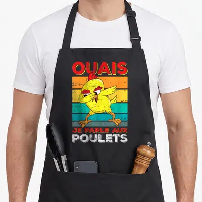 Tablier de cuisine noir avec un poulet jaune en train de faire le dab et le texte Ouais Je Parle Aux Poulets imprimé en lettres colorées.