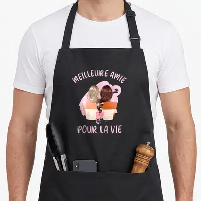 Tablier de cuisine noir avec illustration de deux amies tresses et texte Meilleure Amie Pour La Vie en rose.