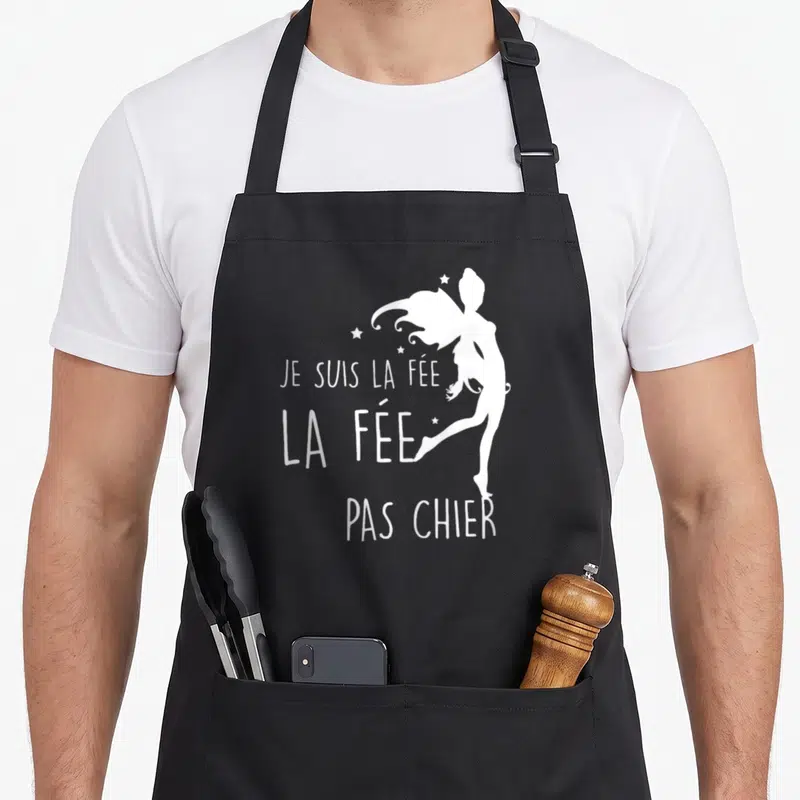 Tablier de cuisine noir avec silhouette blanche de fée et inscription Je suis la fée la fée pas chier.