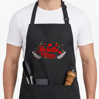 Tablier de cuisine noir avec inscription Bichette dAmour ma chérie entourée de cœurs rouges et d'étoiles dorées.