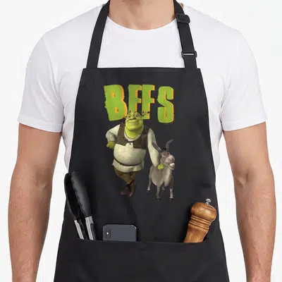 Tablier de cuisine noir avec Shrek, Donkey et l'inscription BFFS en lettres vertes et orange.