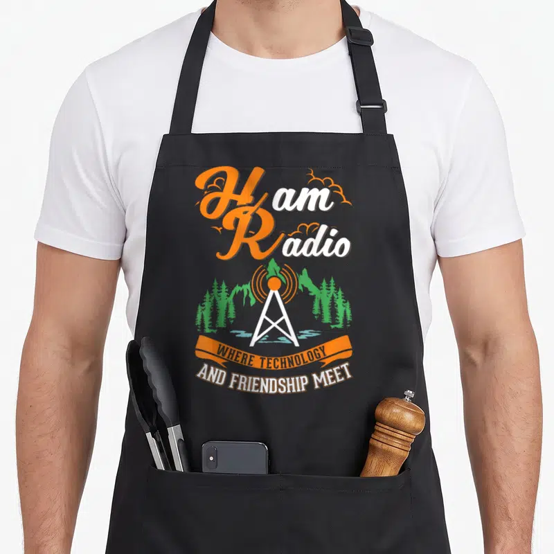 Tablier de cuisine noir avec illustration d'antenne Ham Radio et texte orange blanc sur fond gris uni