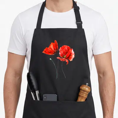 Tablier de cuisine noir avec deux coquelicots rouges et une fleur de pavot en aquarelle sur fond uni.