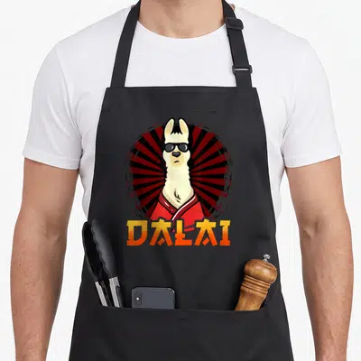 Tablier Dalai Drole Lama Avec Lunettes de soleil — sur un tablier de cuisine noir, fond blanc