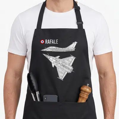 Tablier de cuisine noir avec illustration technique d'un avion Rafale et le drapeau français en haut à gauche.