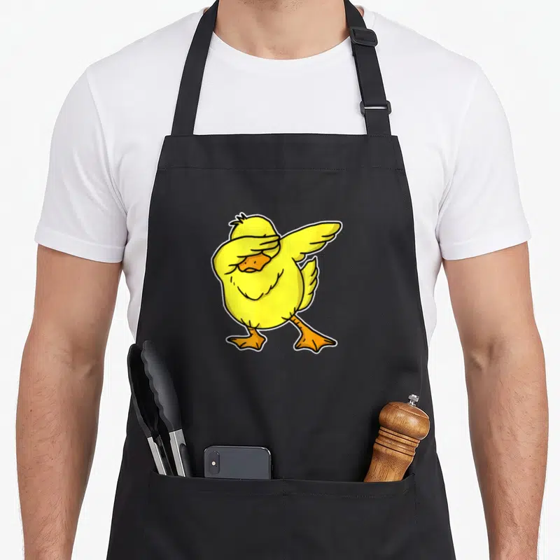 Tablier de cuisine noir avec un canard jaune mignon effectuant une pose dab stylisée.