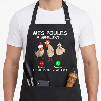 Tablier de cuisine noir avec trois poules cartoon aux grands yeux blancs et les mots Refuser et Accepter en bas.