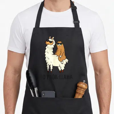 Tablier de cuisine noir avec illustration d'un lama et d'un paresseux portant des lunettes noires au-dessus du texte No Prob-Llama.