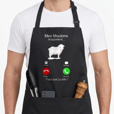 Tablier de cuisine noir avec illustration d'un mouton blanc et boutons de téléphone rouge et vert.
