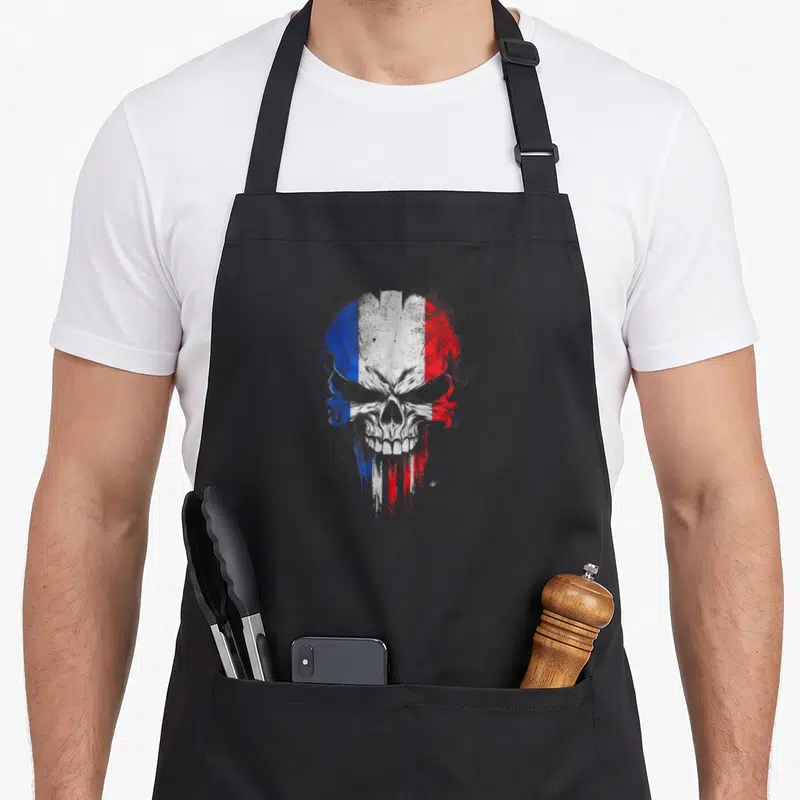 Tablier de cuisine noir avec un crâne aux couleurs du drapeau français en style graffiti.