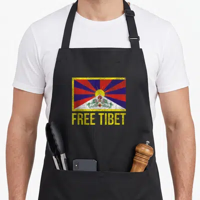 Tablier Emblème du drapeau tibétain du Tibet gratuit pour restaurer le dalaï-lama — sur un tablier de cuisine noir, fond blanc