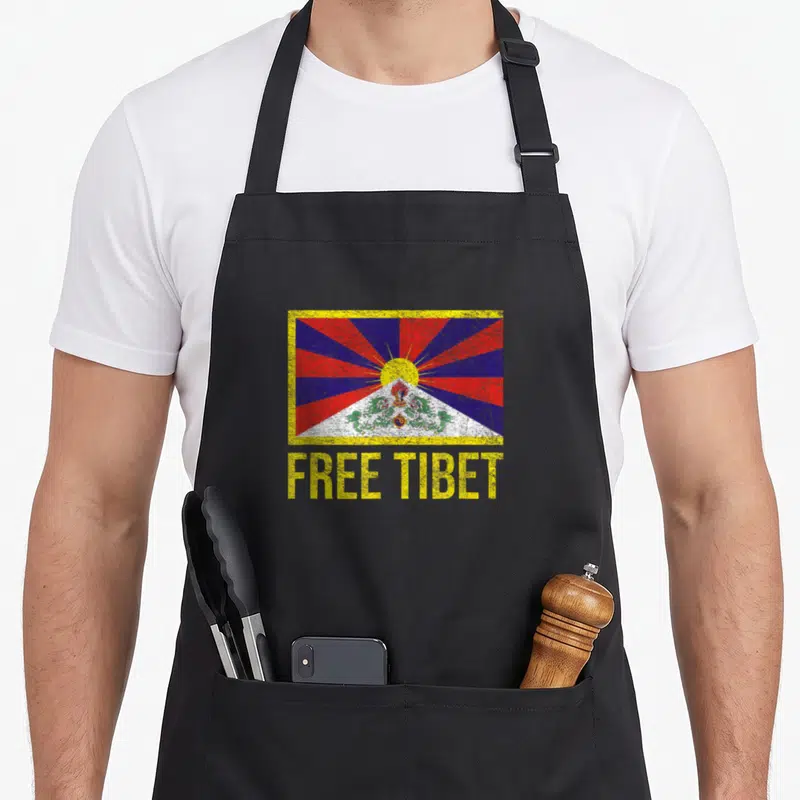 Tablier Emblème du drapeau tibétain du Tibet gratuit pour restaurer le dalaï-lama — sur un tablier de cuisine noir, fond blanc