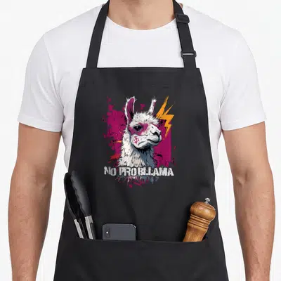 Tablier de cuisine noir avec illustration d'un alpaga blanc aux éclairs roses et texte No Problrama en bas.