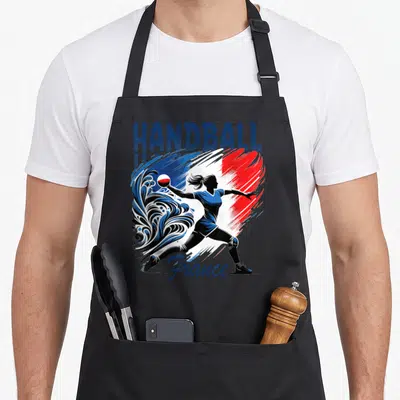 Tablier de cuisine noir avec une handballeuse silhouette bleue sur fond tricolore et texte Handball France