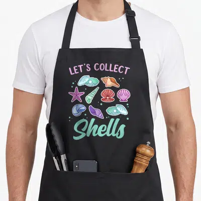 Tablier de cuisine noir avec LET'S COLLECT Shells et divers coquillages colorés.