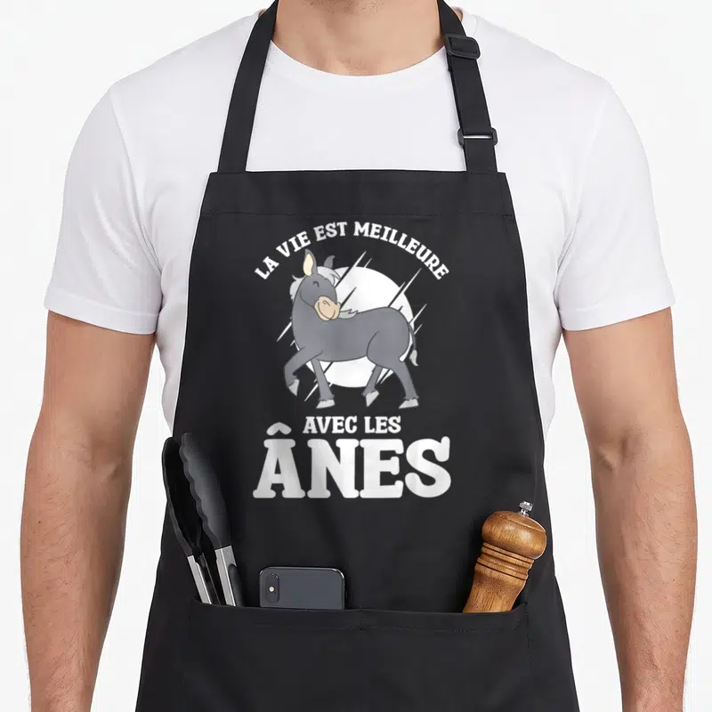 Tablier de cuisine noir avec illustration d'un âne gris et le texte La Vie Est Meilleure Avec Les Ânes en blanc.