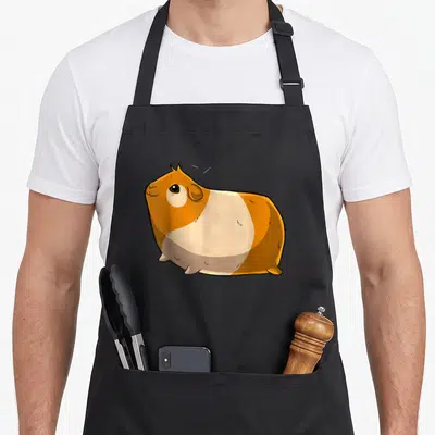 Tablier de cuisine noir avec illustration d'un cochon d'Inde orange et blanc aux contours noirs.