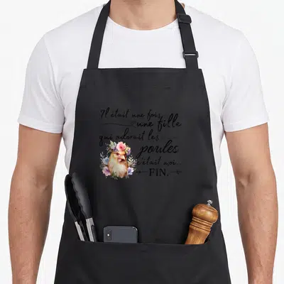 Tablier de cuisine noir avec illustration d'une poule entourée de fleurs et texte Il était une fois une fille qui adorait les poules c'était moi FIN