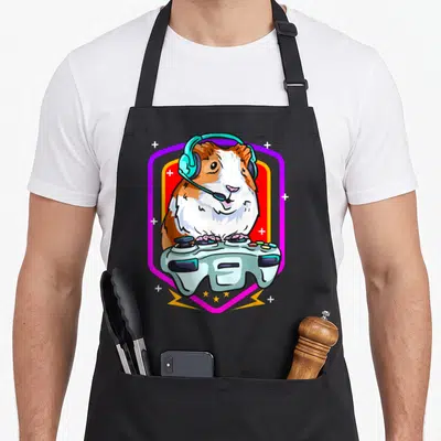 Tablier de cuisine noir avec illustration d'un cochon d'Inde gamer portant un casque et tenant une manette de jeu vidéo.