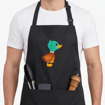 Tablier de cuisine noir avec illustration d'un canard aux têtes vertes et corps brun, style dessin animé simple et mignon.