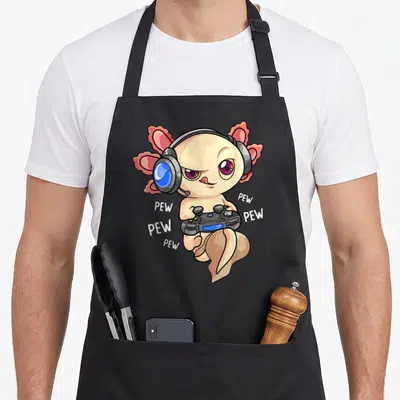 Tablier de cuisine noir avec illustration d'un axolotl kawaii portant un casque et tenant une manette de jeu vidéo entouré de texte PEW.