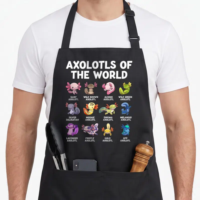 Tablier de cuisine noir avec douze axolotls kawaii colorés et leurs noms en anglais comme Baby Axolotl ou Gold Axolotl.