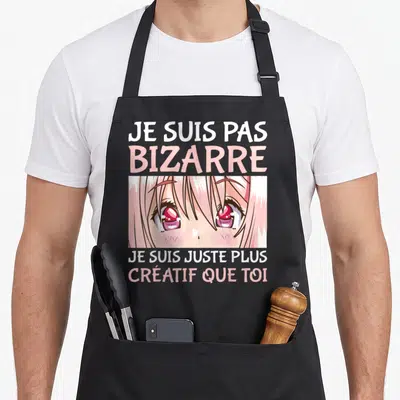 Tablier de cuisine noir avec illustration de yeux d'anime roses et texte humoristique en blanc et rose pastel.
