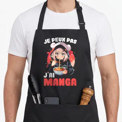 Tablier de cuisine noir avec illustration d'une fille aux cheveux roses mangeant des ramen et le texte Je peux pas j'ai manga.