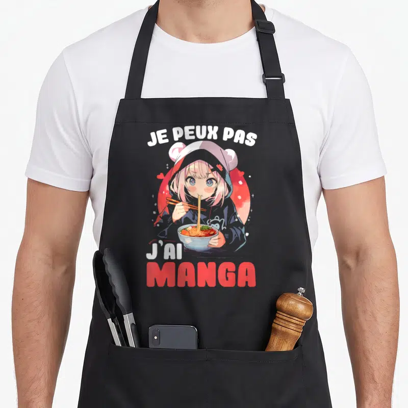 Tablier de cuisine noir avec illustration d'une fille aux cheveux roses mangeant des ramen et le texte Je peux pas j'ai manga.
