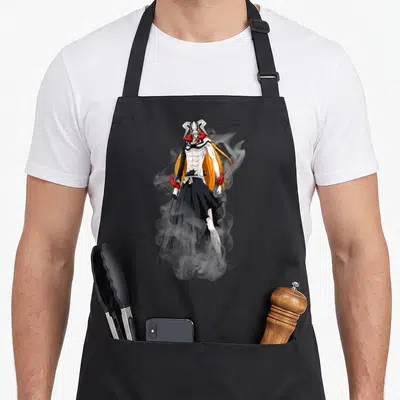 Tablier de cuisine noir avec une illustration d'Ichigo en forme Hollow aux cheveux orange et masque blanc.