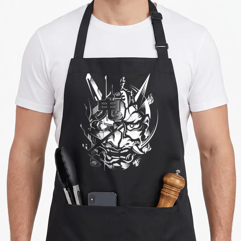 Tablier de cuisine noir avec illustration blanche d'un Oni Cyberpunk Samouraï aux traits agressifs et éléments géométriques.