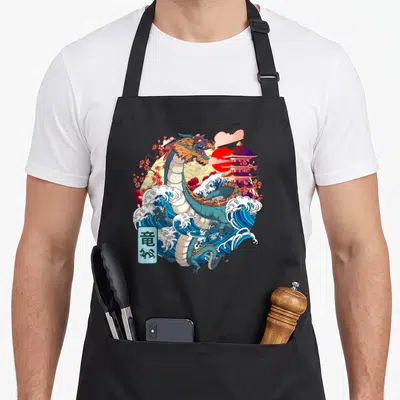 Tablier de cuisine noir avec illustration d'un dragon japonais s'enroulant autour de la Grande Vague de Kanagawa près d'une pagode.