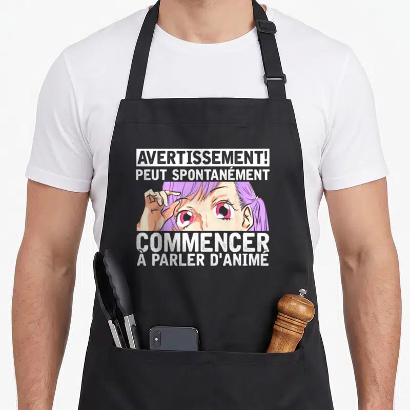 Tablier de cuisine noir avec une illustration d'œil violet et le texte Avertissement peut spontanément commencer à parler d'animé