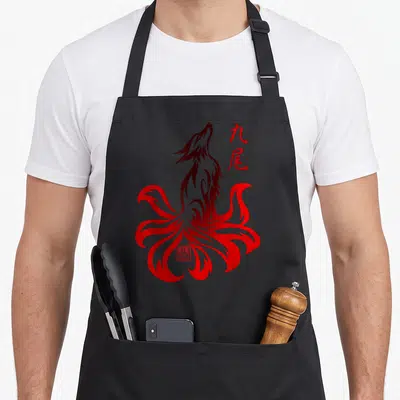 Tablier de cuisine noir avec illustration tribale d'un renard à neuf queues rouge et caractères japonais.