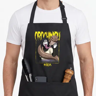 Tablier de cuisine noir avec une illustration d'Orochimaru entouré d'un serpent et encadré par un logo jaune.