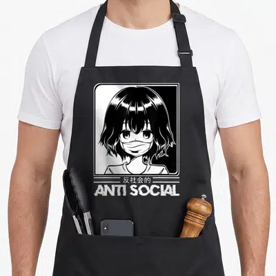 Tablier de cuisine noir avec illustration manga d'une fille au masque et le texte ANTI SOCIAL en bas.
