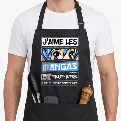 Tablier de cuisine noir avec illustration de yeux manga bleus et texte J'aime les mangas et peut-être une ou deux personnes en typographie stylisée.