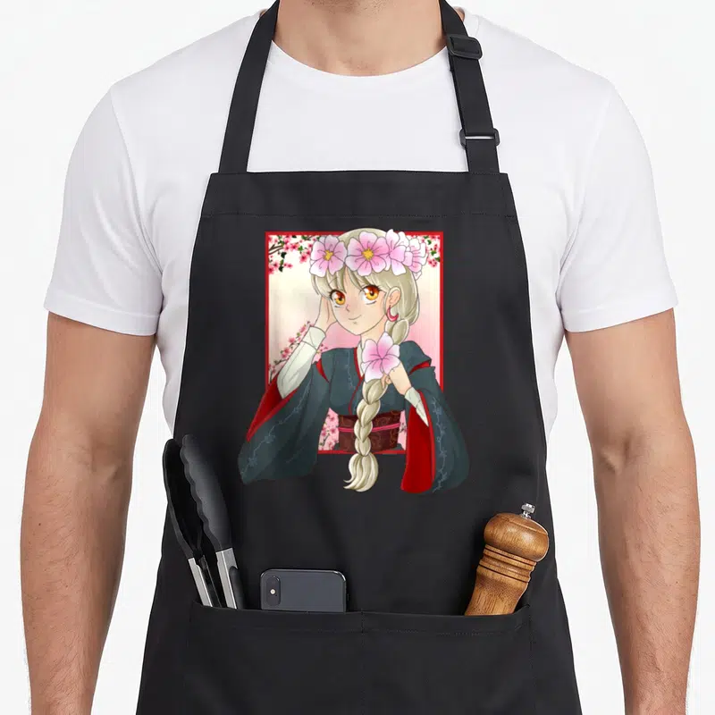 Tablier de cuisine noir avec illustration d'une fille manga aux cheveux blonds tressés et couronne de fleurs roses.