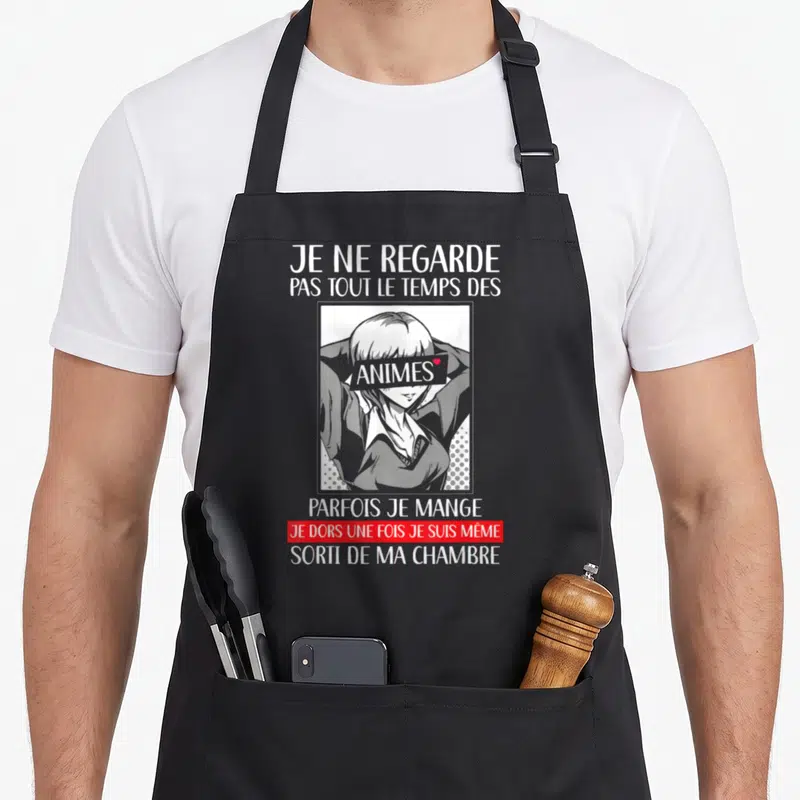 Tablier de cuisine noir avec illustration manga et texte blanc sur la passion des animes japonais