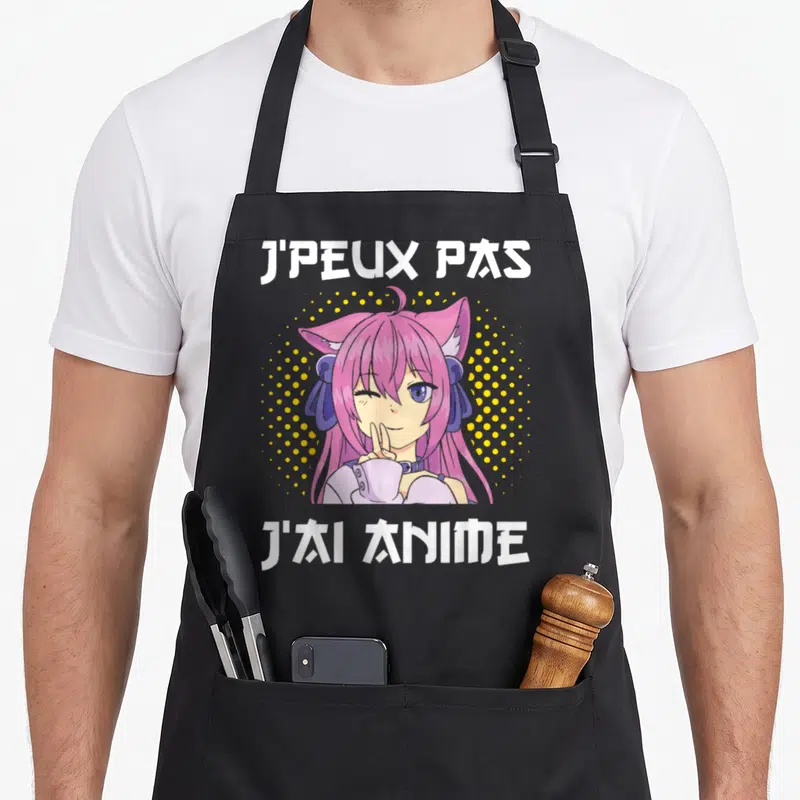 Tablier de cuisine noir avec une illustration d'animeme rose aux oreilles de chat et le texte J'peux pas j'ai anime manga japonais