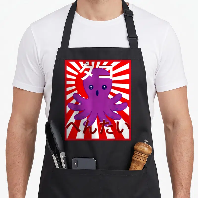 Tablier de cuisine noir avec une illustration d'une pieuvre violette kawaii sur fond de rayons rouges et blancs et du texte en japonais.
