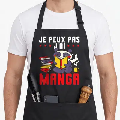 Tablier de cuisine noir avec un panda lisant un livre jaune entouré de mangas et d'une boisson chaude.